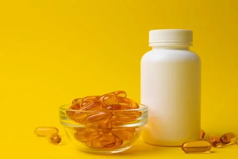 Refined Presentation Highlighting Nutritious Fish Oil Supplements Promoting Stock Photos