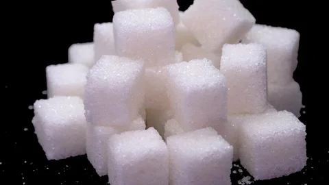 Refined sugar cubes close up rotate on a black background Video stock 128206786