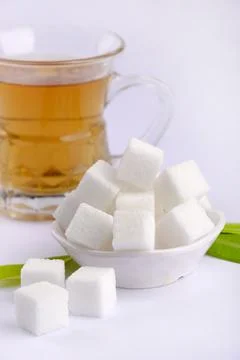 Refined sugar cubes on white background. Foto stock