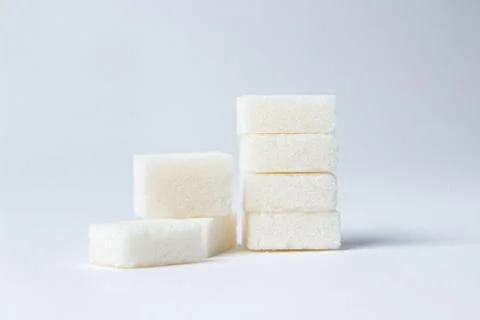 Refined sugar on a white background. Stock Photos