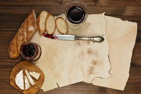 Refined supper on the background of old paper sheets Stock Photos