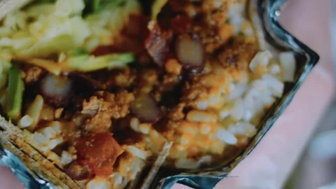 Refined tabletop view: beauty shot of a generous mexican burrito Stock Footage 342168467
