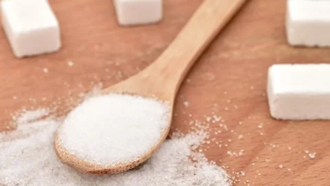 Refined white sugar, sugar cubes and wooden spoon Stock Footage 290919950