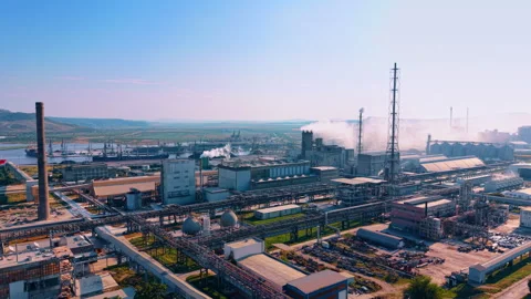 Refinery complex, pipelines and processing towers near a harbor Stock Footage 340081068