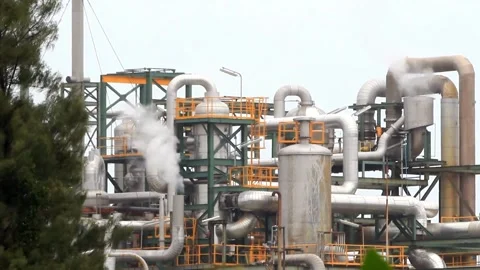 Refinery factory inside. cables, pipelines and valves for chemical mixing. Stock Footage 256677690