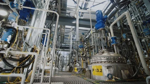 Refinery factory inside. Equipment, steel tanks and boilers for chemical mixing Stock Footage