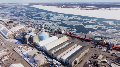 Refinery infrastructure and storage tanks in winter conditions Stock Footage 329452521