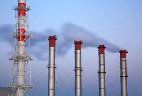 Refinery with smoke stacks Stock Photos