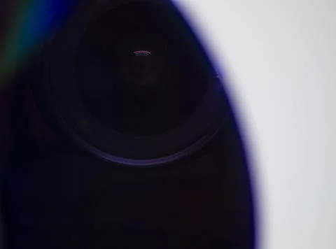 Reflect the lens in the CD. On a white background. Stock Photos