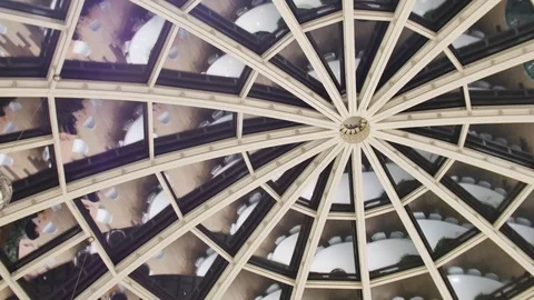 Reflected in the glass dome of the table and the man Stock Footage 69756752