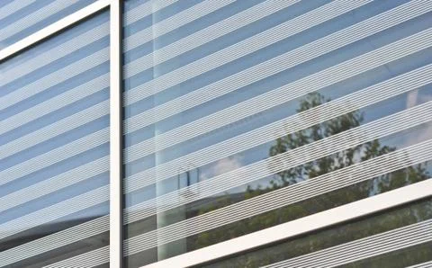 Reflected in the glass facade of the building Stock Photos