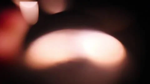 Reflected light of a flashing cigarette lighter Stock Footage 130585555