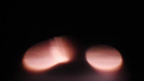 Reflected light of a flashing cigarette lighter Stock Footage 130585580