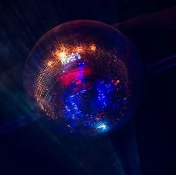 Reflected light of a large disco ball Stock Photos