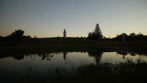 A reflected man jogging in the evening in Sydney's Vaucluse clifftop 6K Stock-Footage 304435929
