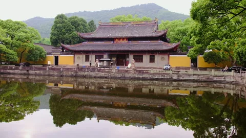 Reflected pond view of temple hall in Ashoka Temple, Ningbo, China, 4K Video stock 272267346