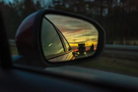 Reflected road in rearview mirror Stock Photos