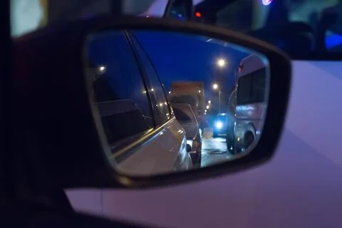 Reflected in side mirror of car Stock Photos