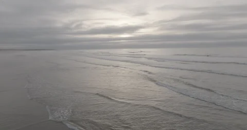 Reflected sunlight and foamy waves at Sidi Rahal beach Video stock 347847096