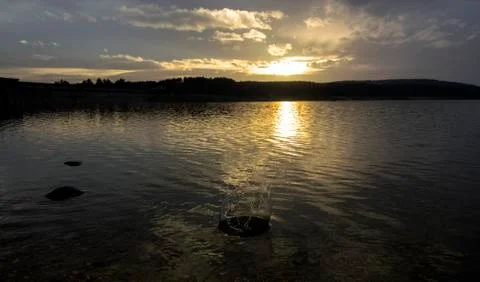 Reflected sunset over the water Stock Photos