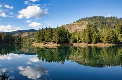 Reflecting Clouds and Mountain 스톡 사진