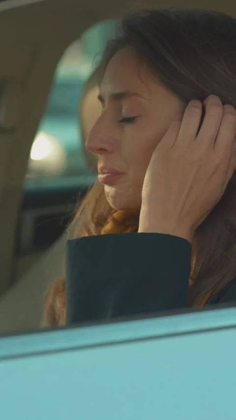 Reflecting on deep emotions while sitting in a car as the autumn landscape Stock Footage 314960532