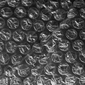 Reflecting light and shadow on creases and tears in plastic bubble wrap sheet, Stock Illustration