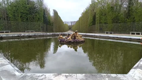 A reflecting pool within the formal gardens of The Palace of Versailles Stock Footage 336693004
