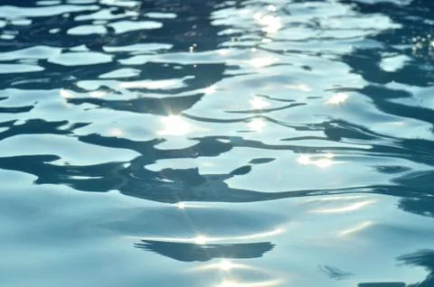Reflecting the rays on the blue waters Stock Photos