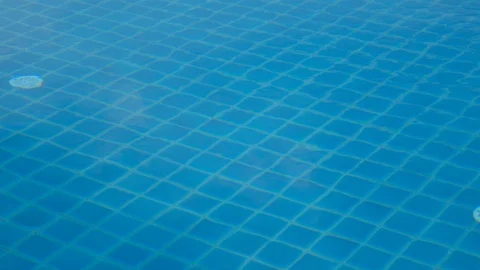 Reflecting water of a swimming pool Stock Footage 101300064