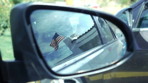 Reflection of a american flag in a car mirror in slow motion 120fps Stock Footage 102215133
