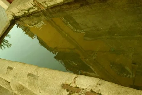 Reflection of an ancient building in the interior of the water Stock Photos