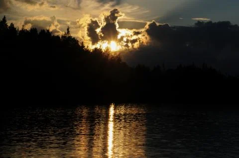 Reflection and shadows over the surface of the lake Stock Photos