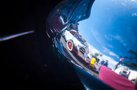 The reflection of another old car in the defense of one Stock Photos