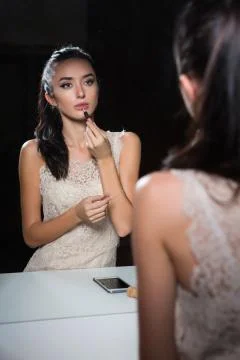 Reflection of attractive young brunette Stock Photos