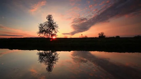 Reflection of a beautiful sky in the lake at dawn Stock Footage 78149573