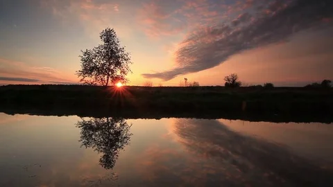 Reflection of a beautiful sky in the lake at dawn Stock Footage 78840834