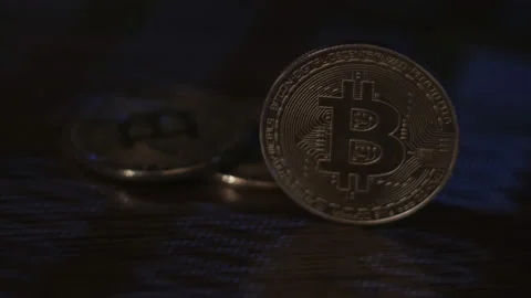 Reflection of binary code on bitcoin coins. Mining of crypto-currencies. Mining Stock Footage 87137373