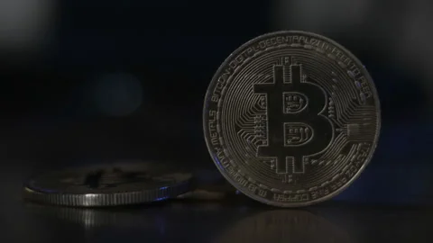 Reflection of binary code on bitcoin coins. Mining of crypto-currencies. Mining Stock Footage 87138643