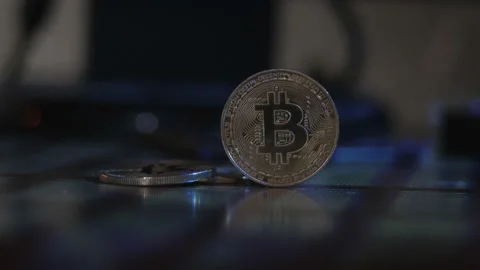 Reflection of binary code on bitcoin coins. Mining of crypto-currencies. Mining Stock Footage 87138845