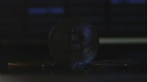 Reflection of binary code on bitcoin coins. Mining of crypto-currencies. Mining Stock Footage 87141480