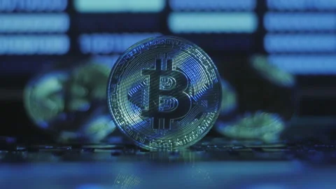 Reflection of binary code on bitcoin coins. Mining of crypto-currencies. Mining Stock Footage 87143631