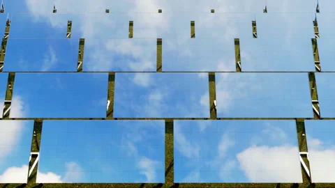 The reflection of the blue sky and clouds on the mirrored-finish of solar panels Stock Footage 211727111