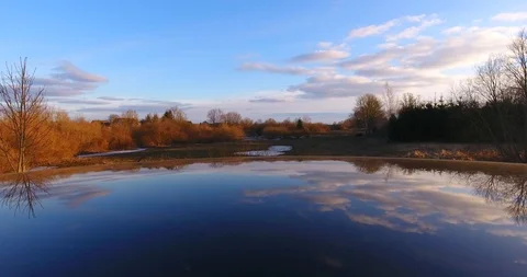 The reflection of blue sky, clouds and trees on the mirror surface - 1 動画素材 87198042