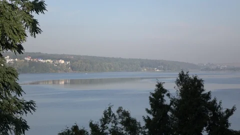 Reflection of the blue sky in the water of a large lake Stock Footage 119101816
