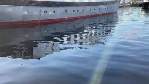 The reflection of a boat in the water with sunshine 스톡 동영상 270323094
