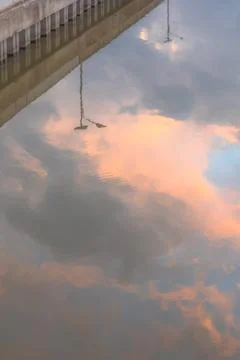 Reflection of Bridge and Sky in Water Stock Photos
