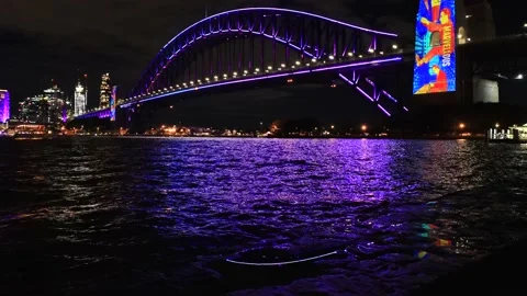 Reflection of bright arch of Sydney Harbour bridge at Vivid Sydney show 4k. Stock Footage 197201162