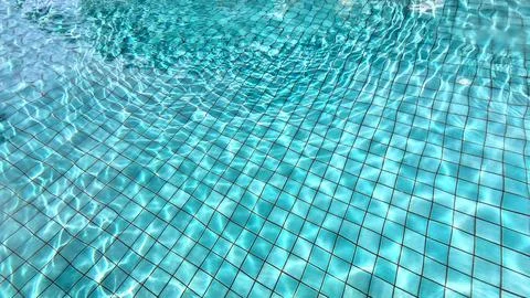 Reflection in a bright blue swimming pool Stock Photos