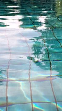 Reflection in a bright blue swimming pool Stock Photos